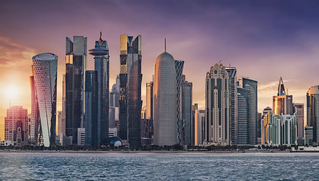 The stunning, modern skyline of Doha, Qatar at dusk.